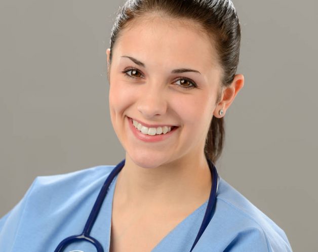 Portrait of smiling young female nurse with stethoscope