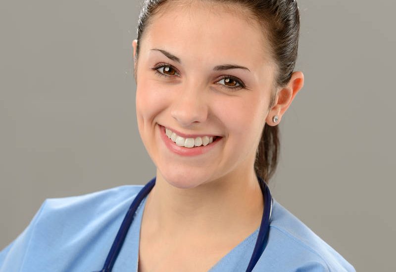 Portrait of smiling young female nurse with stethoscope