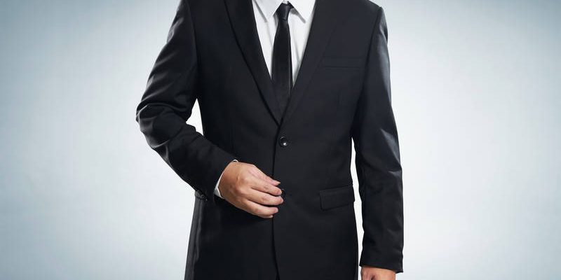 Photo of stylish man in elegant black suit , with clipping path